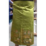 A LATE 19TH/20TH CENTURY CHINESE GREEN SILKWORK SKIRT Late/Qing, decorated with urns and flowers. 16