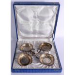 A SET OF ANTIQUE SILVER WINE TASTERS inset with 20 reales silver coins. 238 grams. 10 cm x 7 cm. (4)