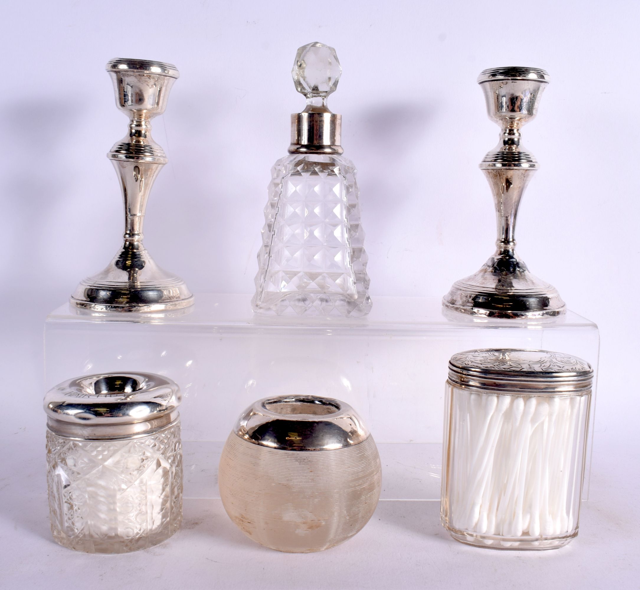 THREE ANTIQUE SILVER TOPPED JARS together with a silver mounted scent bottle & a pair of silver cand