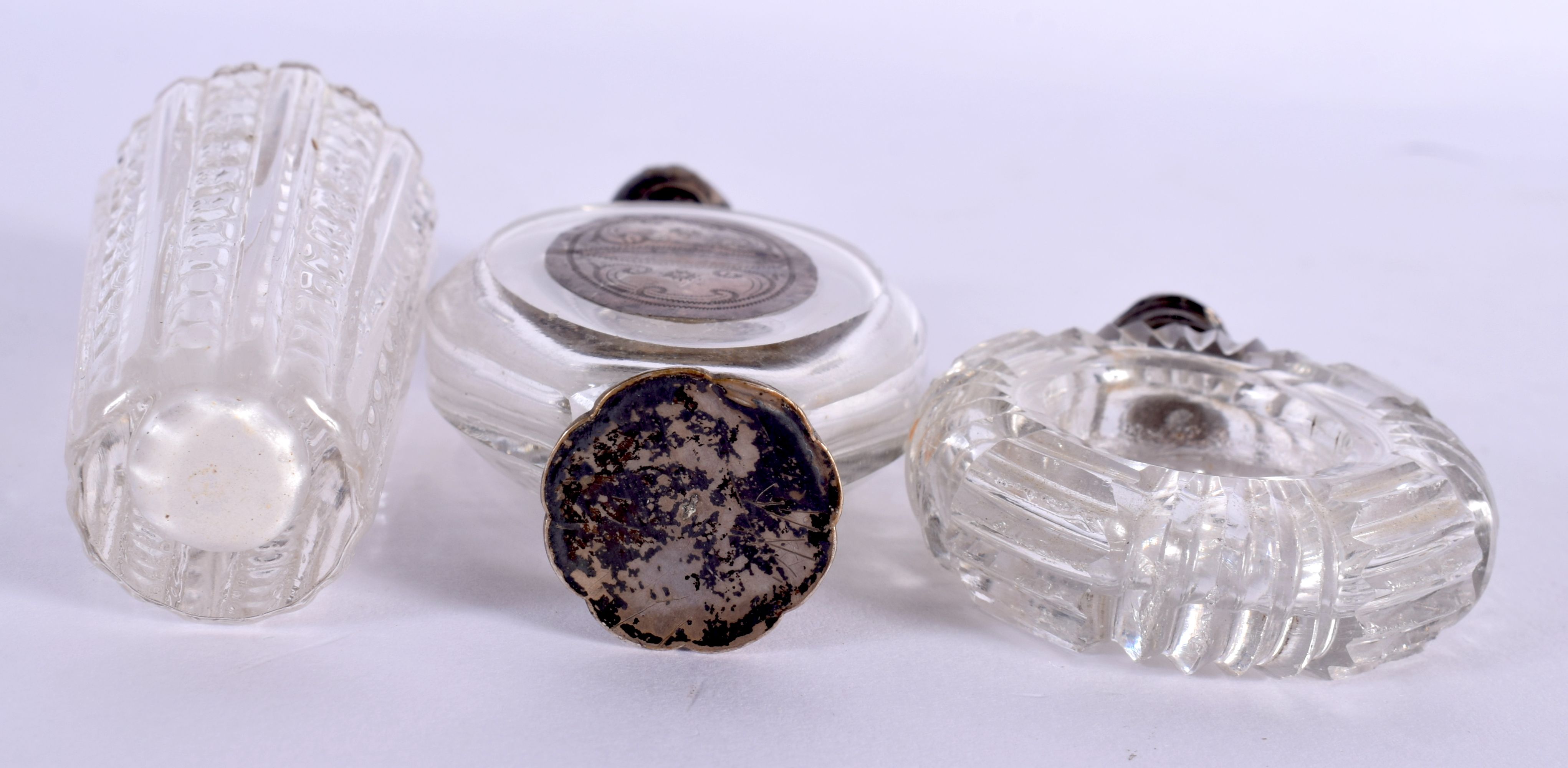 THREE ANTIQUE SILVER TOPPED CRYSTAL GLASS SCENT BOTTLES. Largest 10 cm x 4 cm. (3) - Image 3 of 3