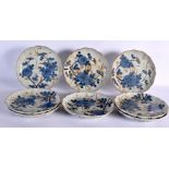 A SET OF EIGHT 19TH CENTURY JAPANESE MEIJI PERIOD IMARI SCALLOPED DISHES painted with flowers. 21 cm