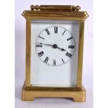 AN EARLY 20TH CENTURY FRENCH BRASS CARRIAGE CLOCK. 13.5 cm high inc handle.