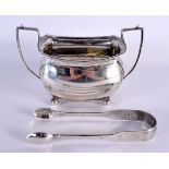 A REGENCY TWIN HANDLED SILVER SUGAR BASIN and a pair of silver sugar tongs. London 1814 & Chester 19