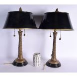 A PAIR OF ANTIQUE COUNTRY HOUSE BRONZE LAMPS decorated with foliage. 47 cm high.