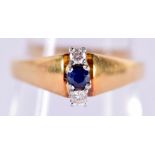 A STYLISH 18CT GOLD SAPPHIRE AND DIAMOND RING. 4 grams.
