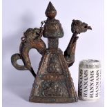 A 19TH CENTURY TIBETAN TURQUOISE INLAID COPPER ALLOY TEAPOT decorated with buddhistic figures. 30 cm