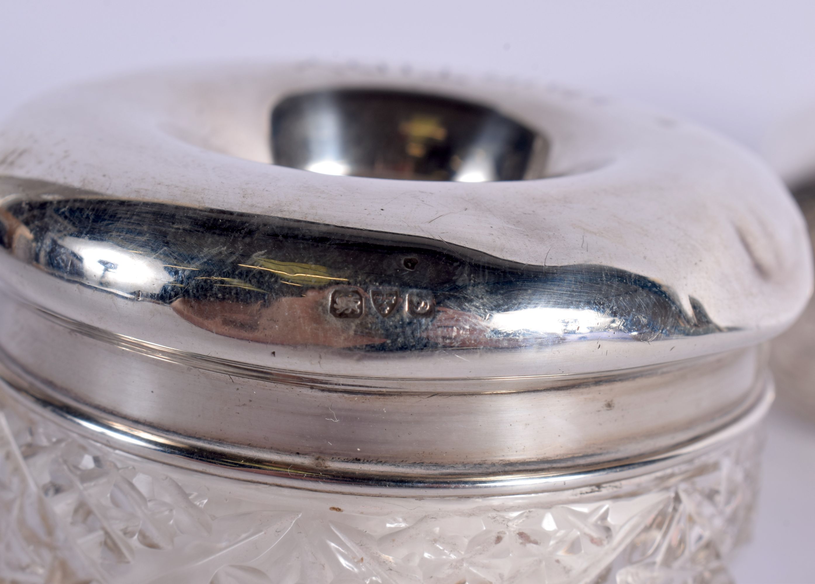 THREE ANTIQUE SILVER TOPPED JARS together with a silver mounted scent bottle & a pair of silver cand - Image 8 of 11