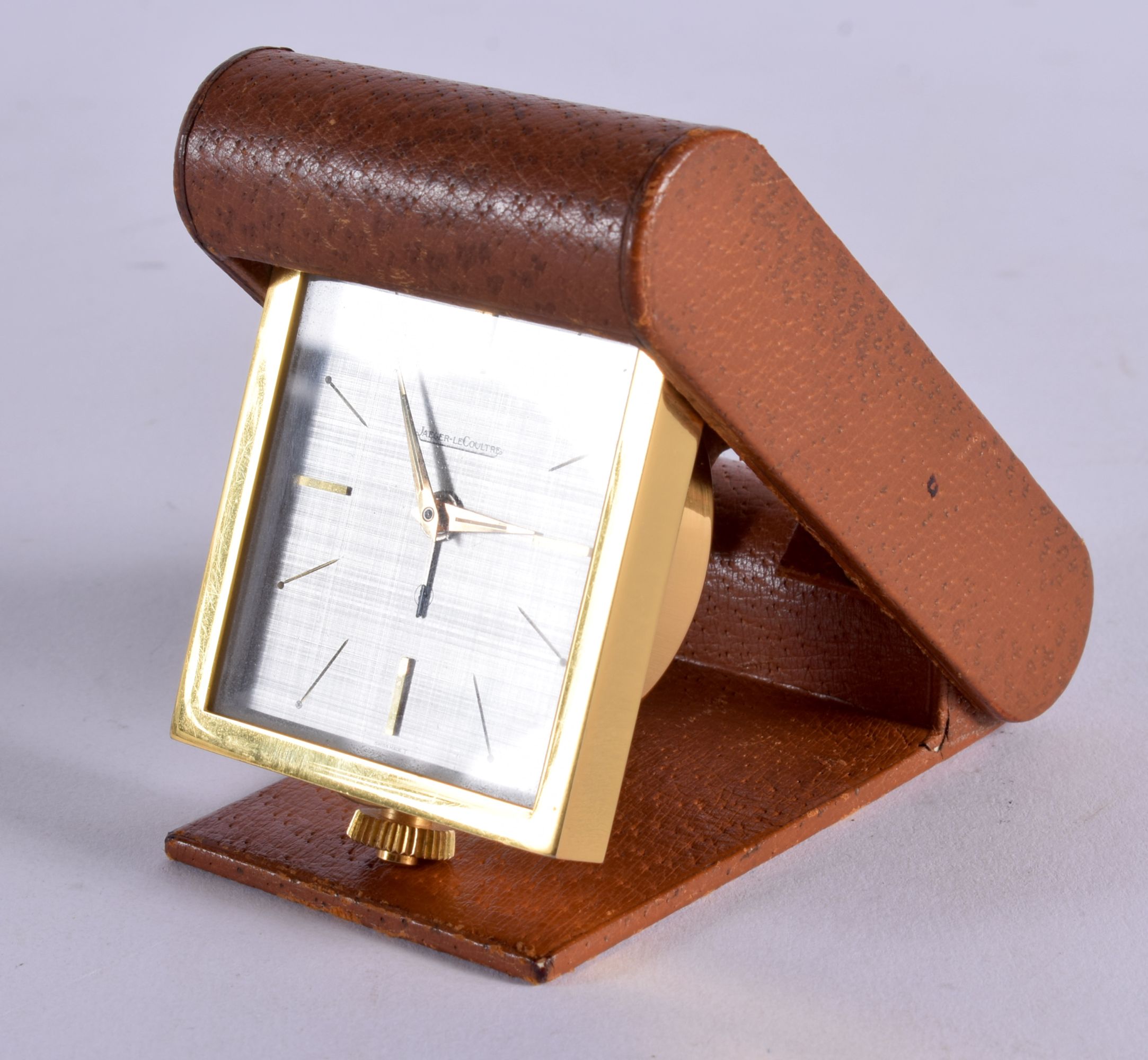 A VINTAGE JAEGER LE COULTRE TRAVELLING LEATHER CASED CLOCK. 6 cm x 9 cm.