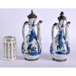 A PAIR OF EARLY 18TH CENTURY JAPANESE EDO PERIOD BLUE AND WHITE EWERS with silver mounts. 25 cm high