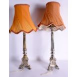 A PAIR OF 18TH/19TH CENTURY CONTINENTAL COUNTRY HOUSE LAMPS decorated with mask heads. 50 cm high.