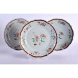 A SET OF THREE CHNESE 18TH CENTURY FAMILLE ROSE PORCELAIN PLATES - with six moulded panel borders, d