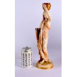 A LARGE ROYAL WORCESTER BLUSH IVORY FIGURE OF A FEMALE modelled holding an urn. 38 cm high.