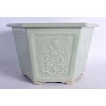 A LARGE 19TH CENTURY CHINESE CELADON HEXAGONAL PORCELAIN PLANTER Qing, decorated with panels of foli