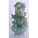 A LATE 19TH/20TH CENTURY CHINESE CARVED JADEITE VASE AND COVER Late Qing, overlaid with a roaming dr