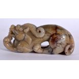 A CHINESE QING DYNASTY MUTTON JADE FIGURE OF A RECUMBANT BEAST. 11 cm x 4 cm.