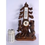 AN EARLY 20TH CENTURY BAVARIAN BLACK FOREST CLOCK BAROMETER formed with two bears. 40 cm x 15 cm.