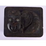 AN UNUSUAL MAORI NEW ZEALAND TRIBAL BOX AND COVER with shell inlaid eyes. 14 cm x 12 cm.