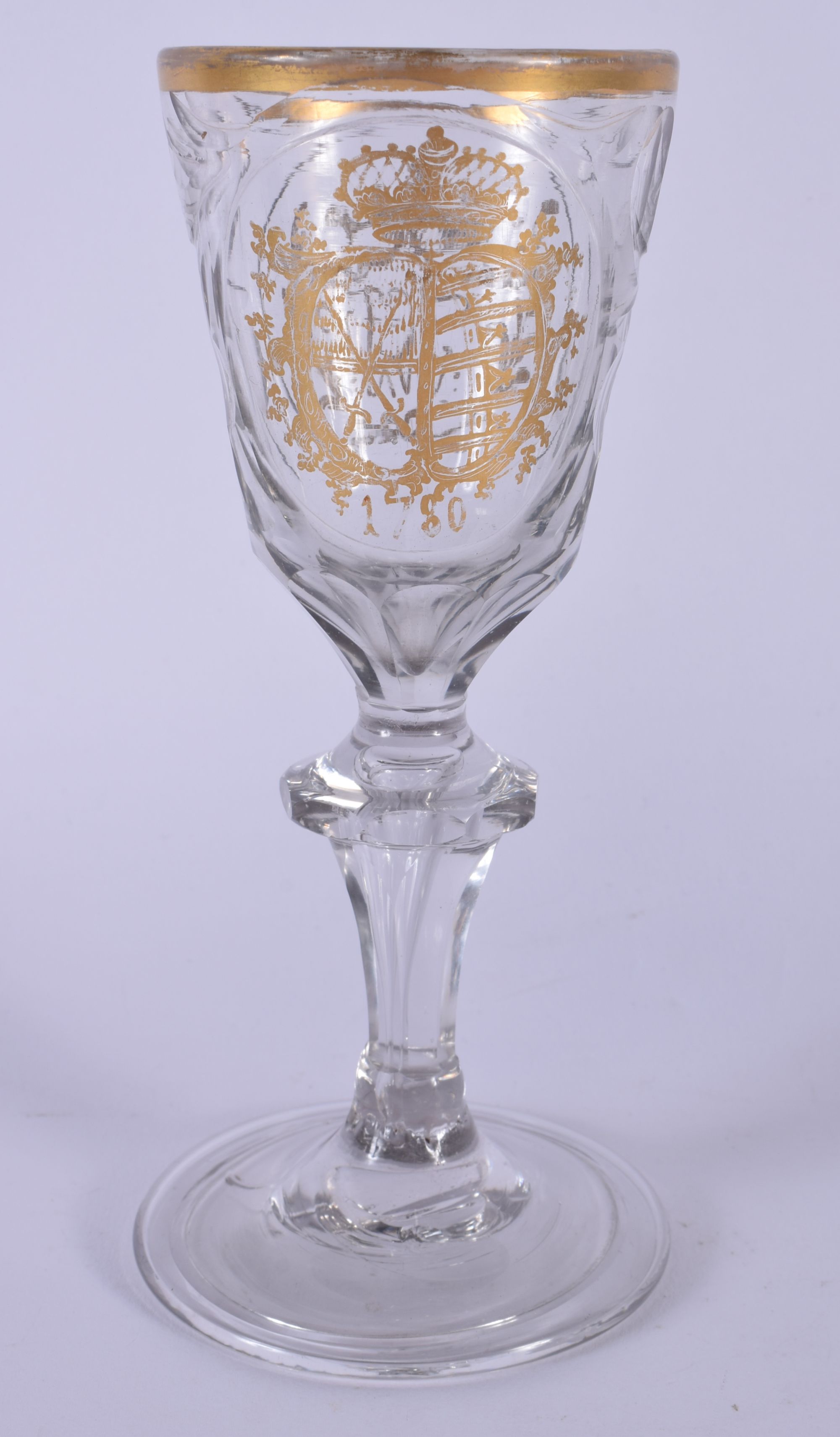 AN 18TH CENTURY GERMAN DRESDEN GLASS dated 1780, highlighted in gilt with an armorial. 16.5 cm high.