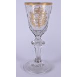 AN 18TH CENTURY GERMAN DRESDEN GLASS dated 1780, highlighted in gilt with an armorial. 16.5 cm high.