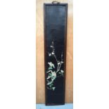 A LARGE 19TH CENTURY CHINESE HARDWOOD AND BLACK LACQUERED PANEL decorated with foliage. 115 cm x 25