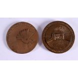 TWO VINTAGE BRONZE MEDALLIONS one decorated with a peace bird, the other with a nude female. 5.75 cm