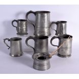 TWO WILLIAM IV PEWTER MUGS together with other similar pewter. Largest 16 cm high. (7)