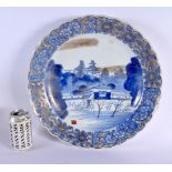 A LARGE 19TH CENTURY JAPANESE MEIJI PERIOD BLUE AND WHITE PORCELAIN CHARGER painted with landscapes.