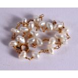 A 20TH CENTURY LADIES PEARL AND GOLD BRACELET with 20 natural pearls mounted upon a delicate gold c
