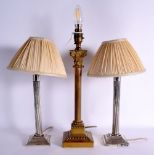 A PAIR OF ANTIQUE SILVER PLATED COUNTRY HOUSE LAMPS together with a large similar bronze column lamp