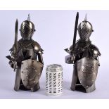 A CHARMING PAIR OF MINIATURE SUITS OF ARMOUR possibly for table use and covering open bottles. 35 cm