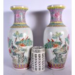 A PAIR OF CHINESE REPUBLICAN PERIOD FAMILLE ROSE VASES painted with birds in landscapes. 32 cm high.