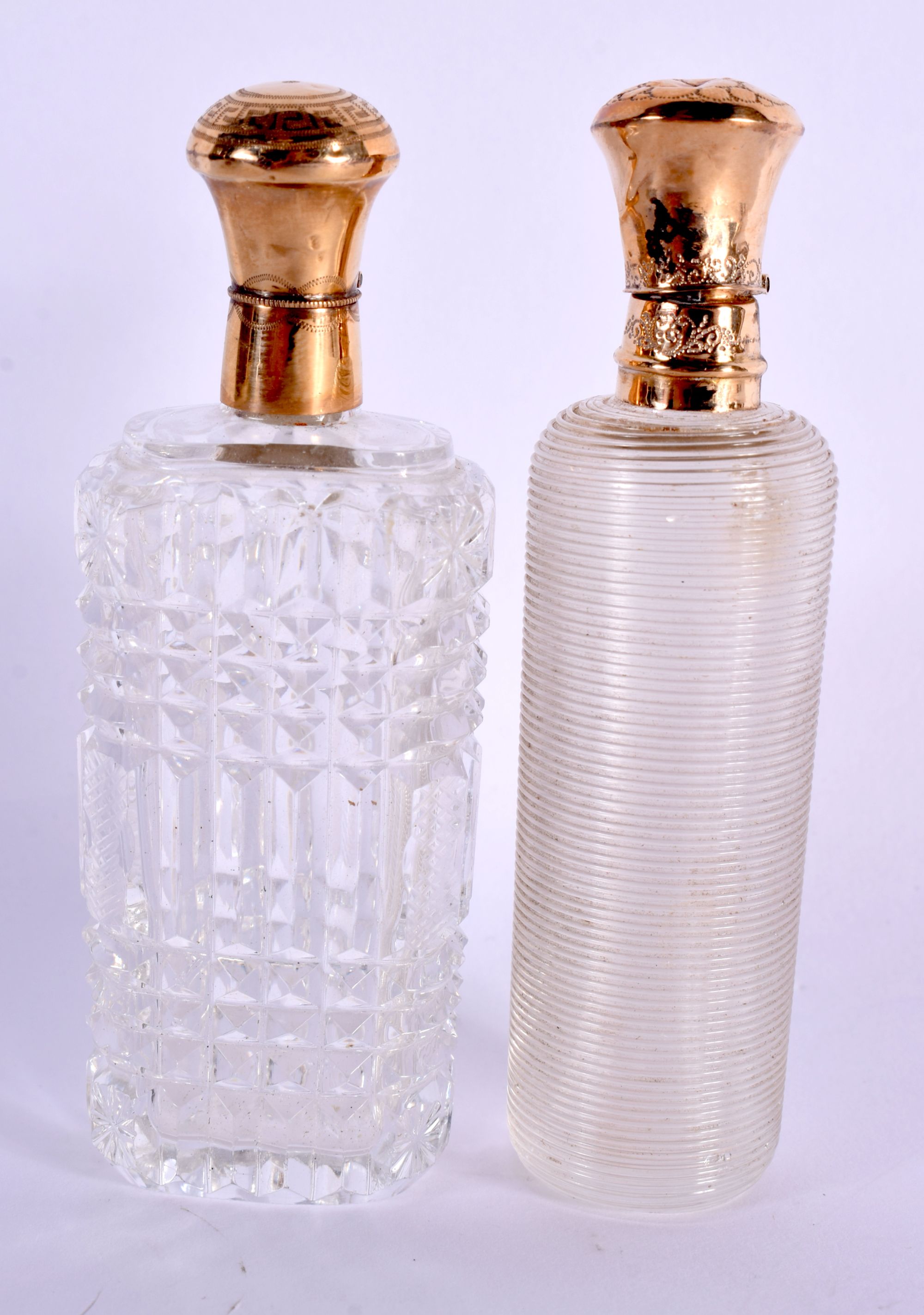 TWO ANTIQUE GOLD FRENCH CRYSTAL GLASS SCENT BOTTLES. 9 cm x 3 cm. (2)