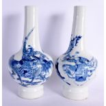 A PAIR OF 19TH CENTURY CHINESE BLUE AND WHITE PORCELAIN BULBOUS VASES bearing Kangxi marks to base,