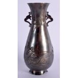 A LATE 19TH CENTURY JAPANESE MEIJI PERIOD TWIN HANDLED SILVER VASE decorated with a minogame and bir