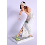 A 1920S ROSENTHAL PORCELAIN FIGURE OF A SNAKE CHARMER modelled by B Boehs. 21 cm high.