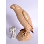 AN UNUSUAL EARLY 20TH CENTURY ENGLISH STONEWARE FIGURE OF HAWK. 34 cm x 14 cm.