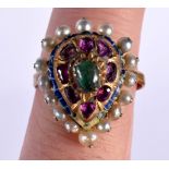 A 19TH CENTURY PERSIAN ENAMEL, RUBY,EMERALD AND PEARL RING with pearl outer beads surrounding a step