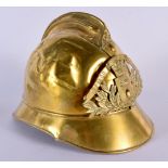 AN ANTIQUE BRASS FIREMANS HELMET. 24 cm wide.