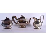 AN ANTIQUE DUTCH SILVER TEASET. 1045 grams. Largest 25 cm x 16 cm. (3)