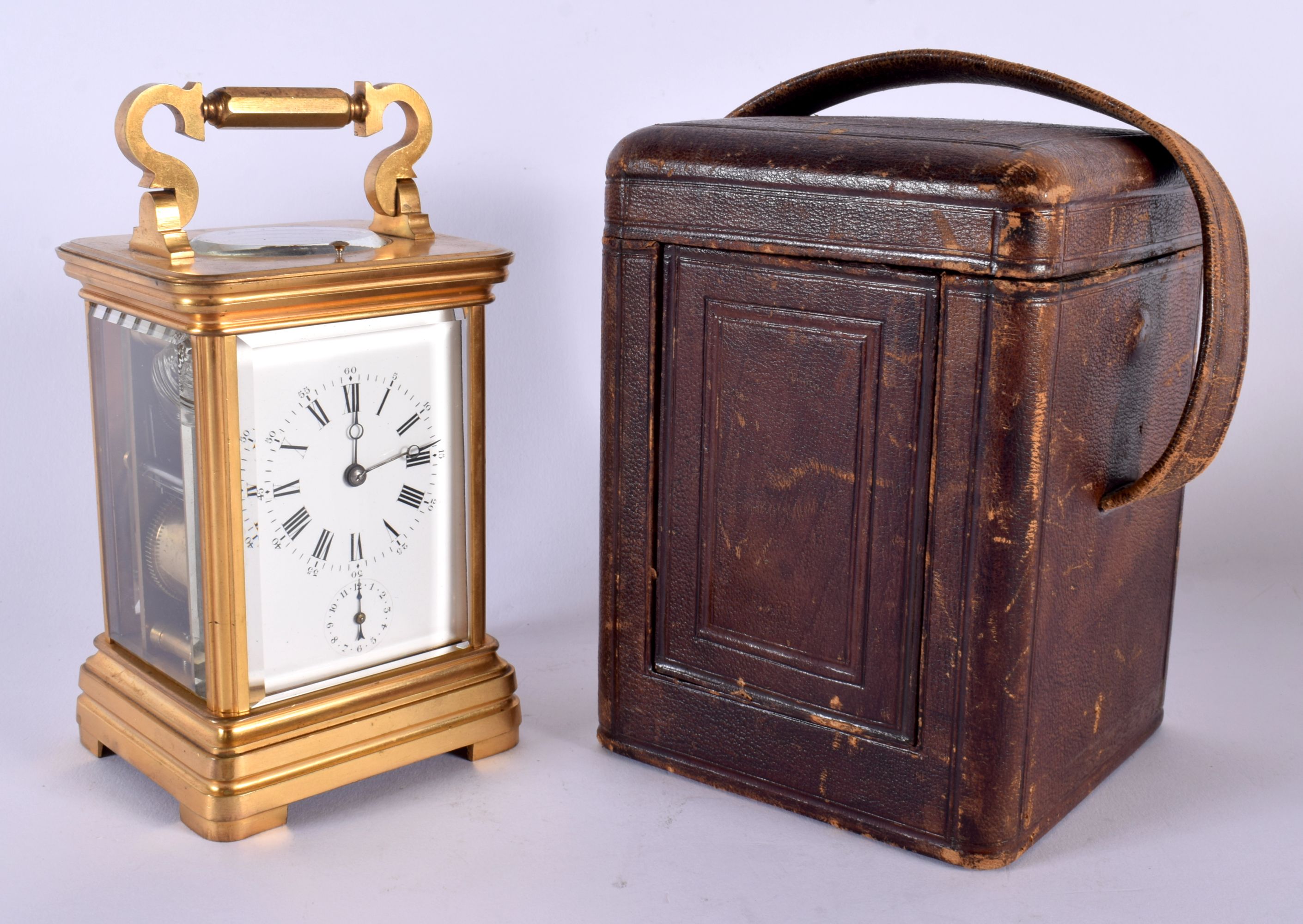 AN ANTIQUE FRENCH CASED REPEATING CARRIAGE CLOCK with subsidiary dial. 18.5 cm high inc handle.