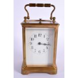 A FRENCH REPEATING BRASS CARRIAGE CLOCK. 16 cm high inc handle.