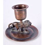 AN UNUSUAL 19TH CENTURY ENGLISH GRAND TOUR LION CHAMBERSTICK. 6.5 cm x 5.25 cm.