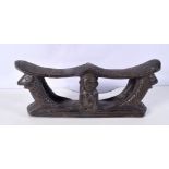 A carved African tribal headrest 12 x 31 cm.
