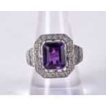 AN 18CT WHITE GOLD, DIAMOND AND AMETHYST RING. Stamped 18K, Size O, weight 9.6g