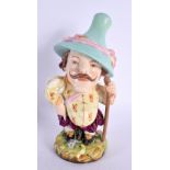 Royal Worcester rare figure of a Mansion Dwarf standing wear a tall hat and steadying himself with a