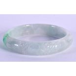 A CHINESE CARVED JADE BANGLE 20th Century. 5.75 cm diameter.