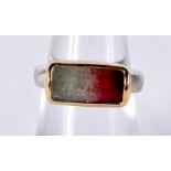 AN 18CT GOLD AND SILVER HARDSTONE RING. L. 6 grams.