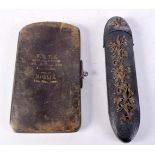 AN ANTIQUE PURSE and a glasses case. Largest 15.5 cm x 3.5 cm. (2)