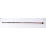 A tigers eye polished stone handled bamboo walking cane with silver banding engraved with 'Lord Henn