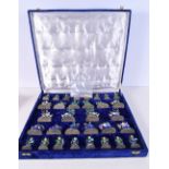 A RARE INDIAN SILVER AND ENAMEL CHESS SET modelled in various forms and sizes. 1266 grams. Largest 8